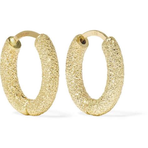 carolina bucci gold earrings.